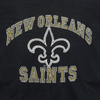 Close-up of the New Orleans Saints wordmark and fleur-de-lis print on the black 1990s V-neck T-shirt.