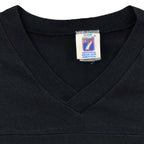 Close-up of the Logo 7 neck label with no readable size inside the black and white 1990s T-shirt.