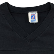 Close-up of the Logo 7 neck label with no readable size inside the black and white 1990s T-shirt.
