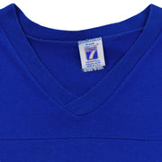 Close-up of the Logo 7 neck label with no readable size inside the blue and white 1994 T-shirt.
