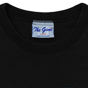 Close-up of the The Game neck label showing size L inside the black 1995 T-shirt.