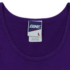 Close-up of the Bike neck label showing size L inside the purple 1995 tank top.