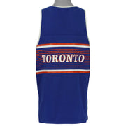 Back view of the 1990s Toronto Blue Jays tank top, showing the blue mesh back with red-and-white stripes and Toronto wordmark