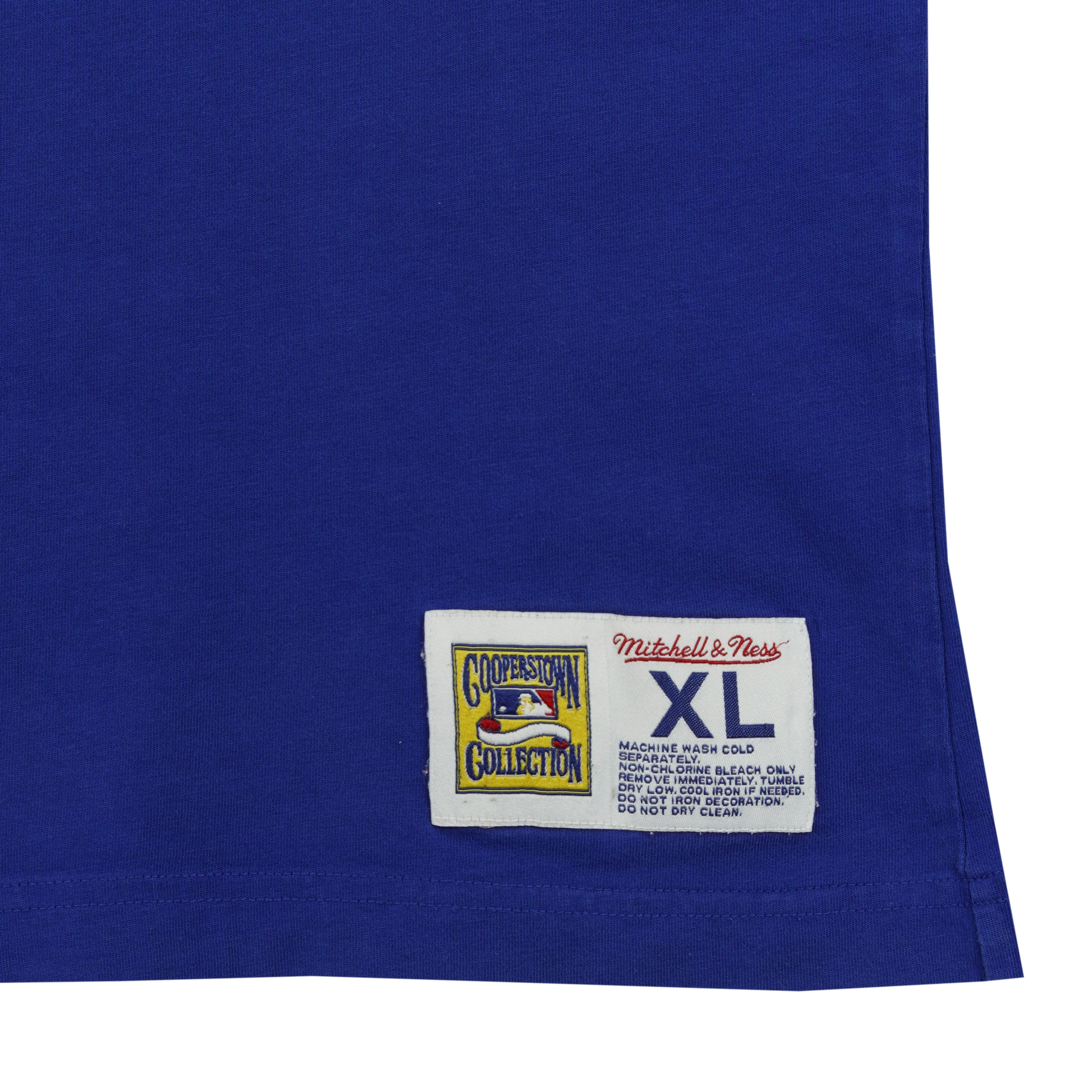 Close-up of the Mitchell & Ness Cooperstown Collection hem patch on the blue mesh Blue Jays tank top.