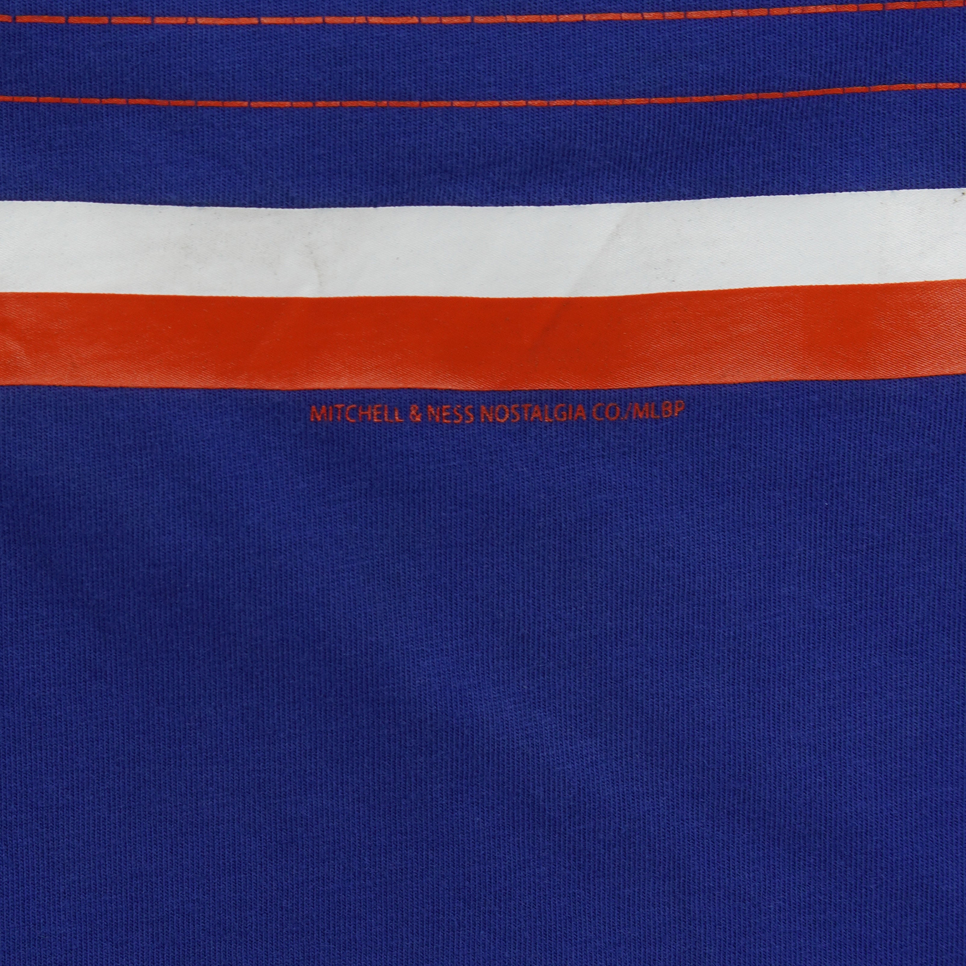 Close-up of the red-and-white striped panel and blue mesh fabric on the Blue Jays Cooperstown tank top.