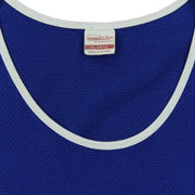 Close-up of the Mitchell & Ness neck label showing size XL inside the blue, white and red 1990s tank top.