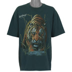 Front view of the green 1990s Hanes Beefy-T t-shirt showing Rainforest Cafe tiger emerging through tall grass