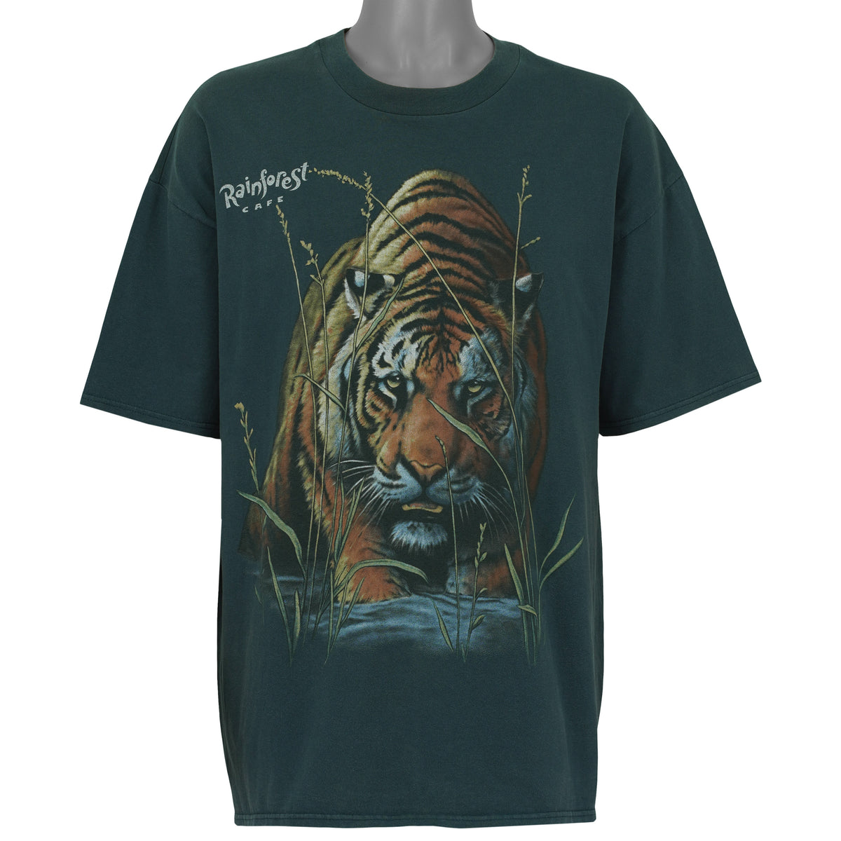 Front view of the green 1990s Hanes Beefy-T t-shirt showing Rainforest Cafe tiger emerging through tall grass