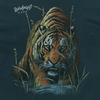 Close view of Rainforest Cafe tiger emerging through tall grass printed on the green 1990s Hanes Beefy-T t-shirt