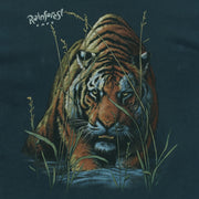 Close view of Rainforest Cafe tiger emerging through tall grass printed on the green 1990s Hanes Beefy-T t-shirt