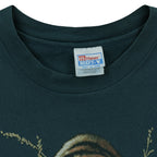 Close-up of the Hanes Beefy-T neck label showing size XXL inside the green 1990s T-shirt.
