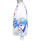 Right-side view of the white Blue Jays sweatshirt showing the all-over team print across the sleeve and body.