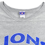 Close-up of the faded neck tag and gray crew-neck collar on the 1993 Detroit Lions T-shirt.