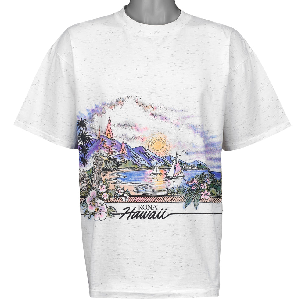 Front view of white speckled T-shirt with Kona Hawaii mountains, ocean, island, and sun scene.