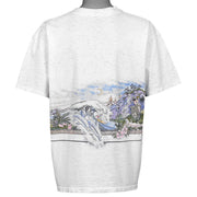 Back view of the Kona Hawaii shirt with a dolphin, ocean wave, moon, and mountain scenery.