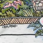 Close view of tropical flowers, the printed border, and San Segal 1991 copyright.