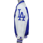 Side view of the white Dodgers jacket sleeve with large blue LA lettering