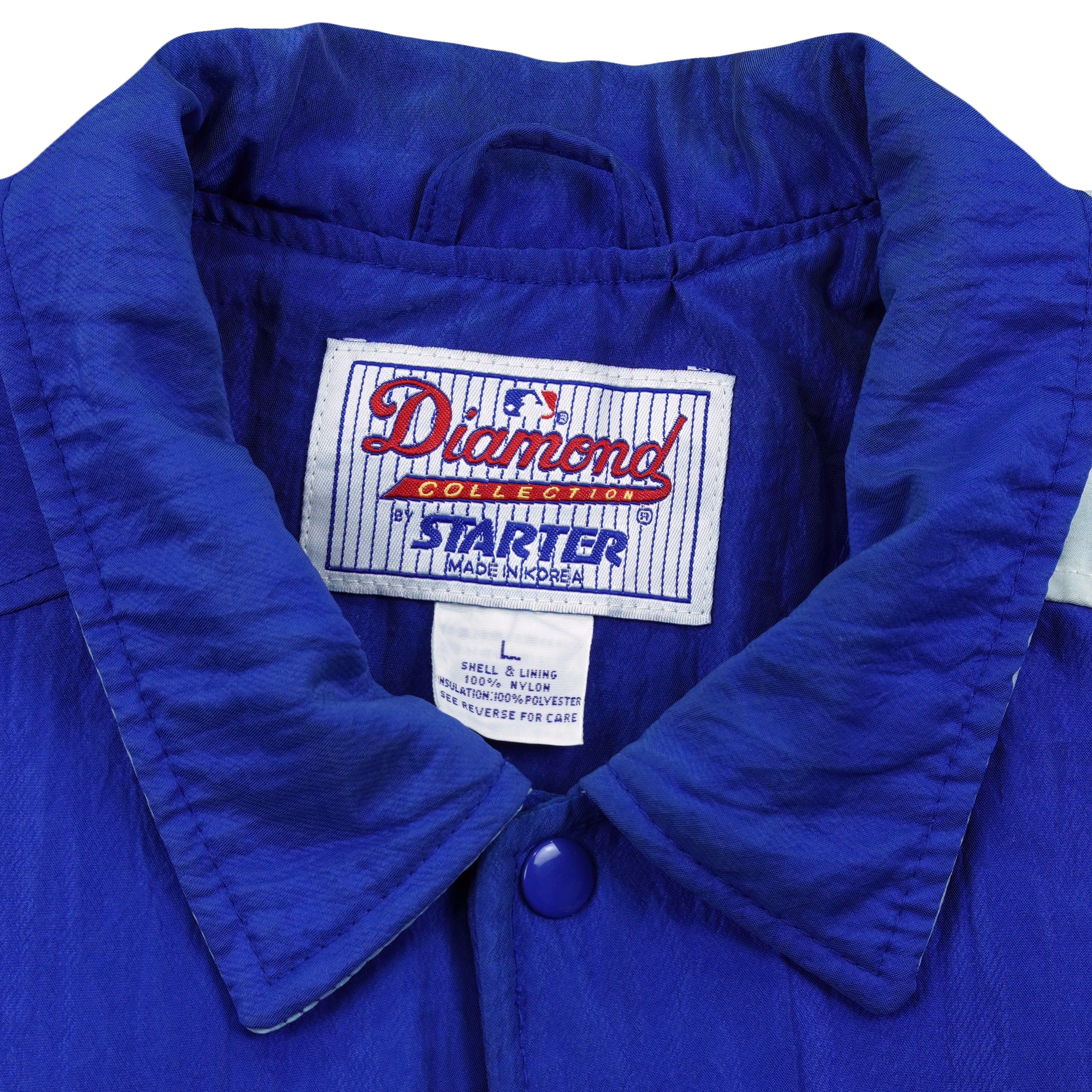 Close-up of the Starter Diamond Collection label inside the blue Dodgers jacket