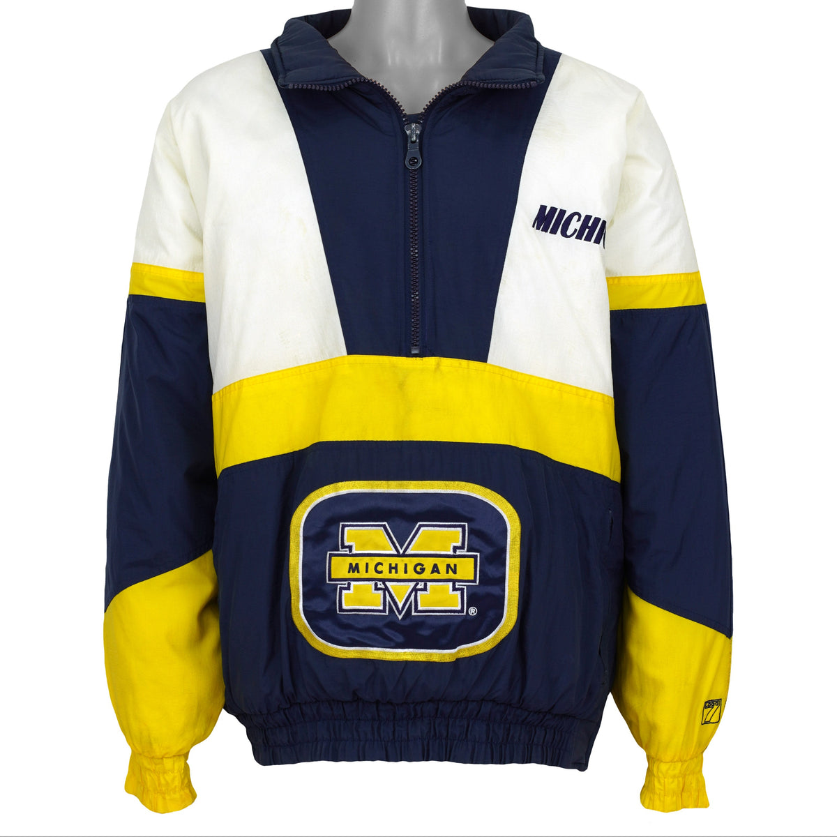 Navy Michigan Wolverines colorblock NCAA jacket front showing the complete garment and main artwork by Logo 7 from the 1990s