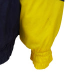 Mark near the sleeve and underarm of the Michigan Wolverines jacket