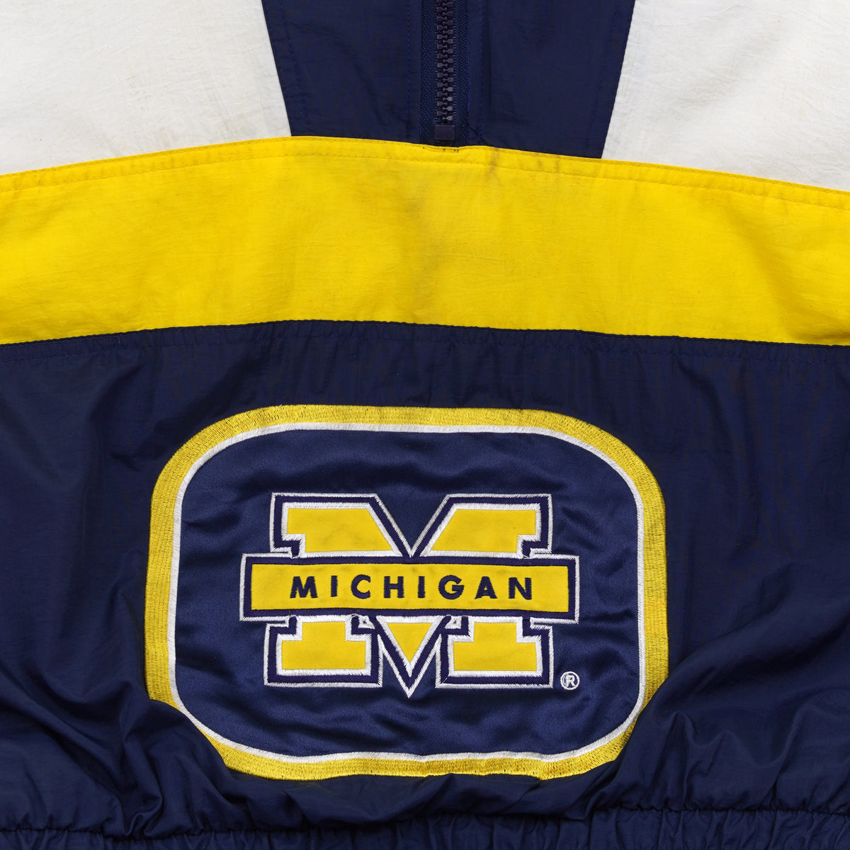 Michigan Wolverines logo on the front pouch pocket close-up