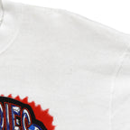Close view of a small mark on the white sweatshirt shoulder
