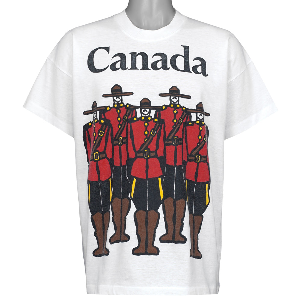 White Canada souvenir T-shirt front with five Royal Canadian Mounties from the 1990s