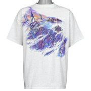 Gray San Segal New York T-shirt front with a purple city skyline scene, dated 1989