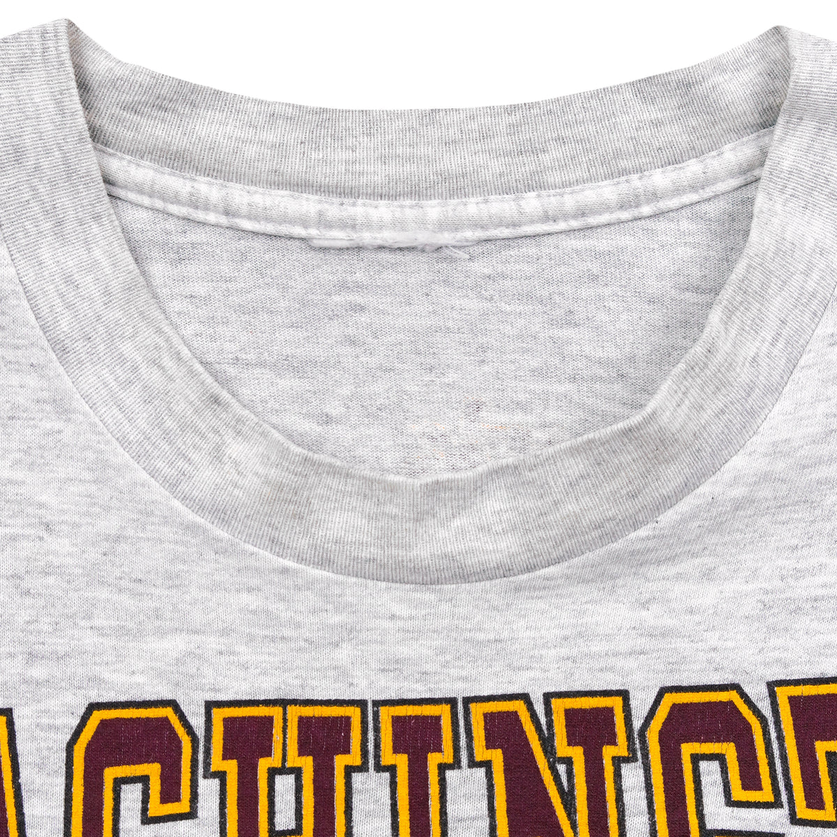Blank gray collar area with no readable garment label