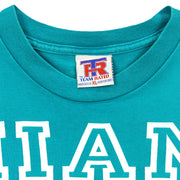 Close-up of the Team Rated XL label inside the teal Dolphins T-shirt