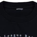 Close-up of the removed neck label inside the black Subway Series T-shirt