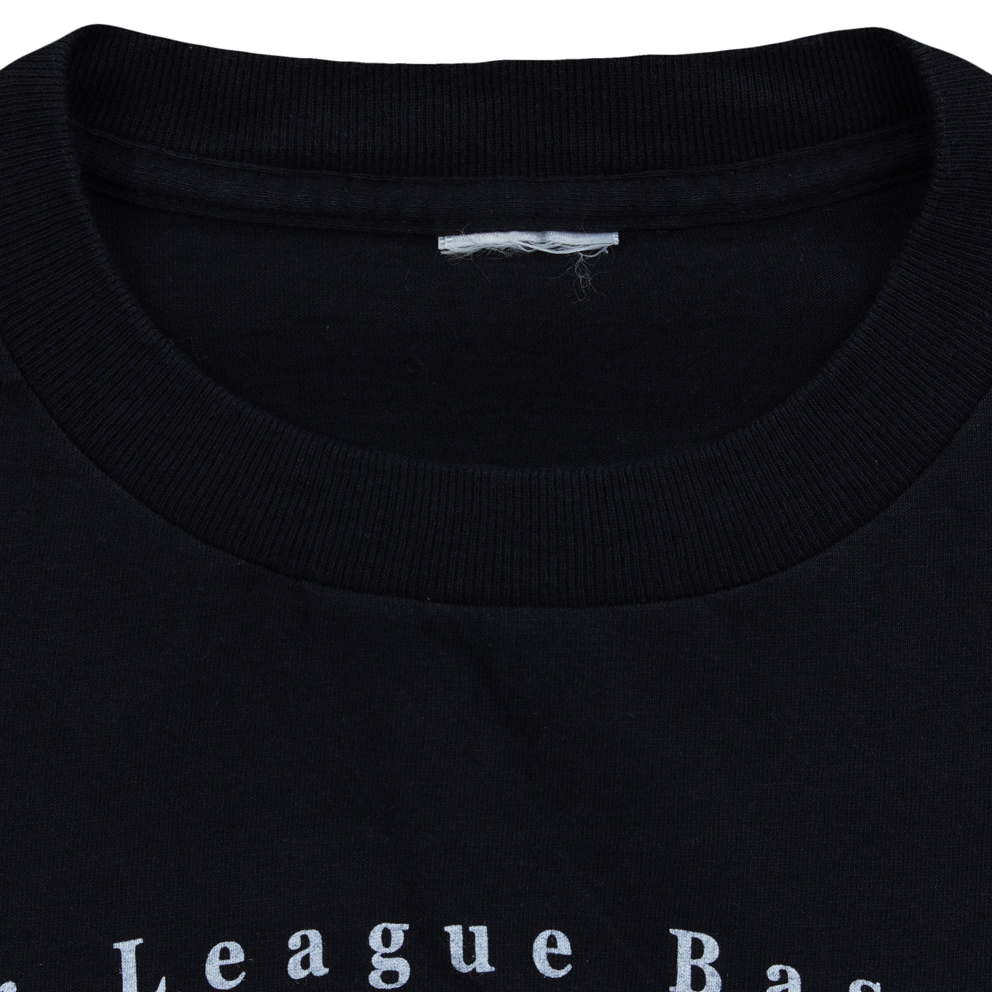 Close-up of the removed neck label inside the black Subway Series T-shirt
