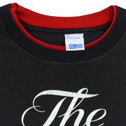 Close-up of the Salem Sportswear XL label and red inner collar