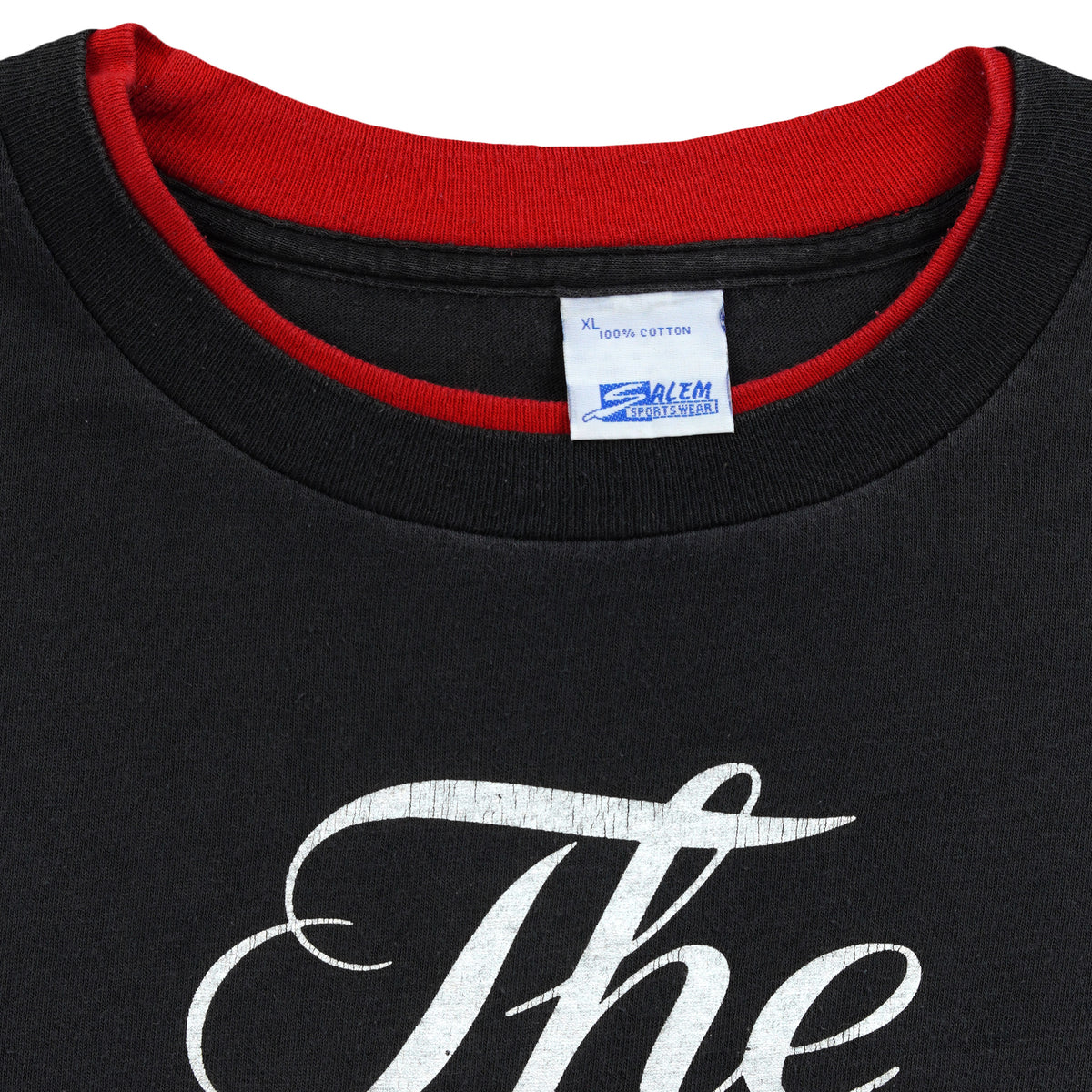 Close-up of the Salem Sportswear XL label and red inner collar