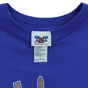 Close-up of the TNT by Trau and Loevner XL label inside the blue T-shirt