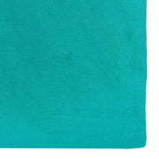 Close view of small marks near the lower hem of the UCLA shirt