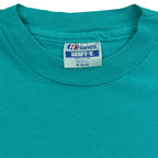 Hanes Beefy-T Medium label inside the turquoise Bruins T-shirt