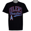Black Houston Oilers NFL T-shirt front with red and blue script logo by Hanes from the 1990s