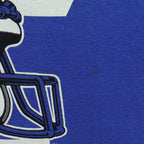 Detail of a minor mark beside the faded helmet print on blue fabric