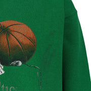 Close-up of the cracked basketball and Celtics team-history print