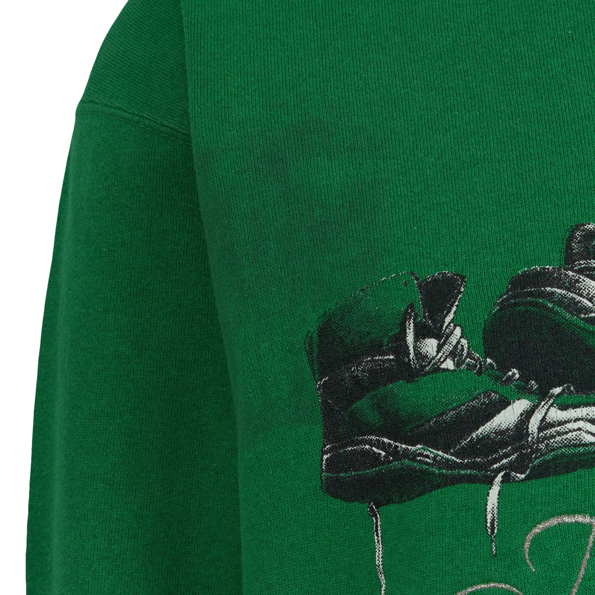Close view of basketball shoes in the Boston Celtics front artwork
