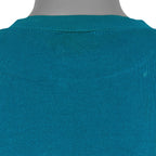 Close view of the repaired upper-back area and small fabric mark