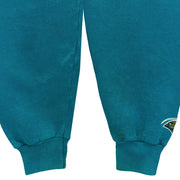 Teal sweatshirt sleeves showing marks and a Jaguars cuff logo