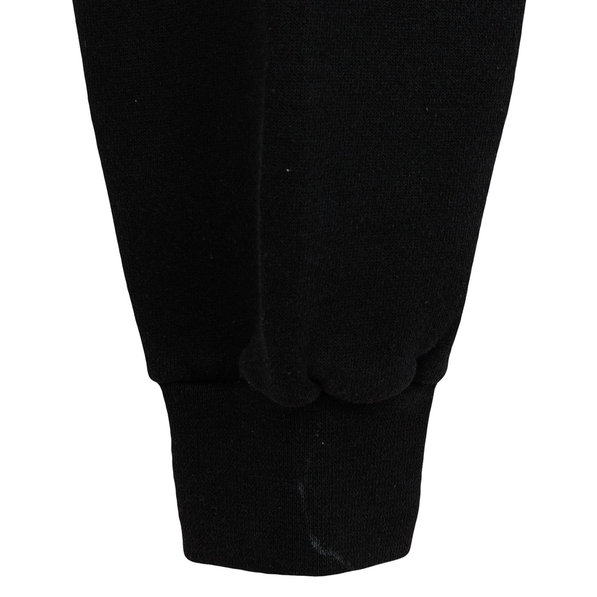 Close view of a minor mark near the black sweatshirt cuff