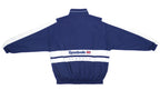Reebok - Dark Blue & White Classic Spell-Out Windbreaker 1990s X-Large Vintage Retro