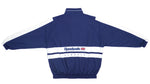 Reebok - Dark Blue & White Classic Spell-Out Windbreaker 1990s X-Large Vintage Retro