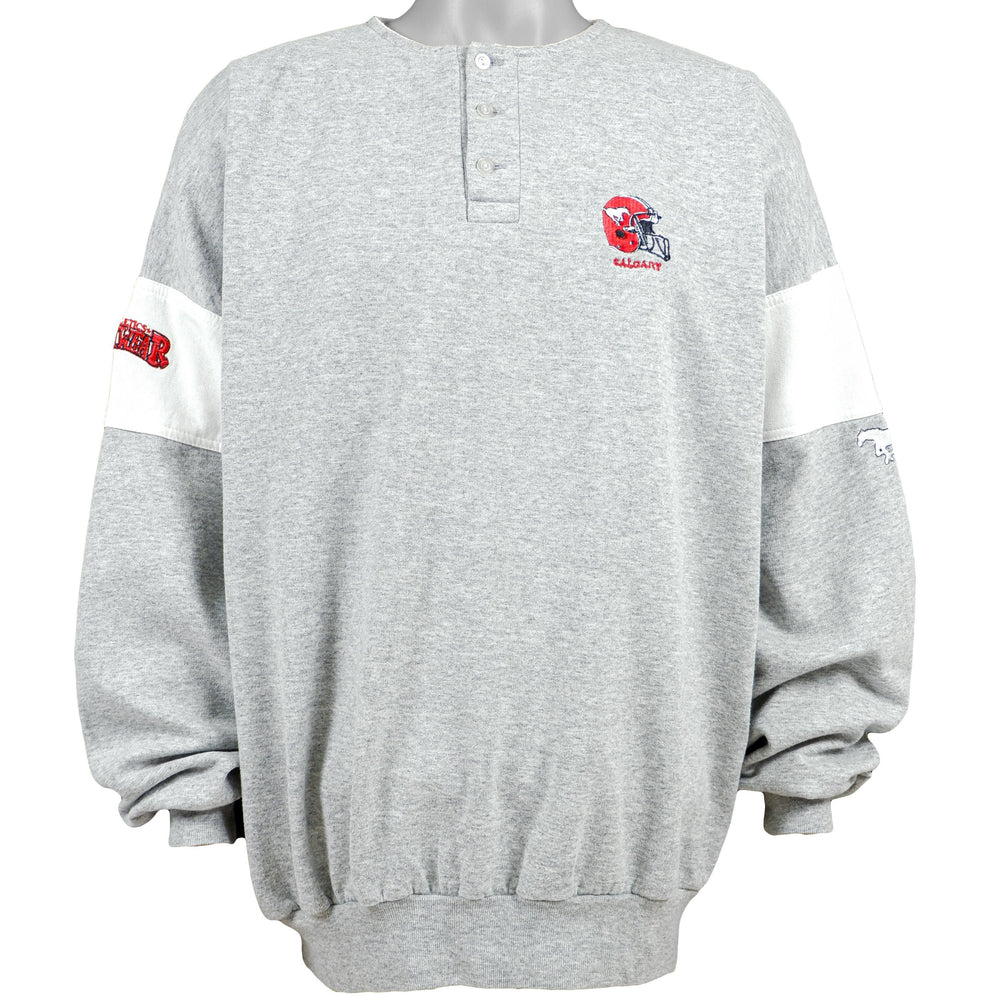 Vintage (Athletics Softwear) - Calgary Stampeders 1/4 Button Sweatshirt 1990s X-Large Vintage Retro Football