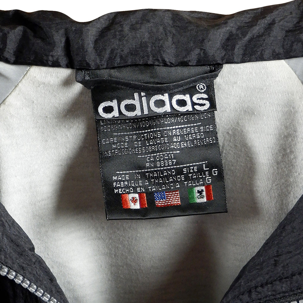 Adidas - Black Stripe Tape Logo Windbreaker 1990s Large Vintage Retro