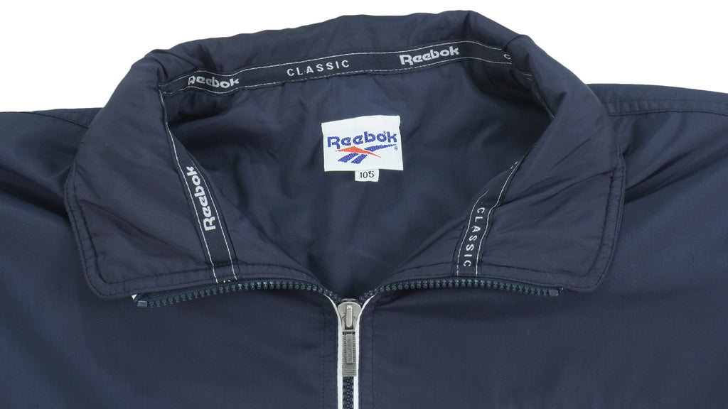 Reebok - Navy Blue Classic Spell-Out Windbreaker 1990s X-Large Vintage Retro