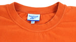 Reebok - Orange Big Spell-Out T-Shirt 1990s X-Large Vintage Retro